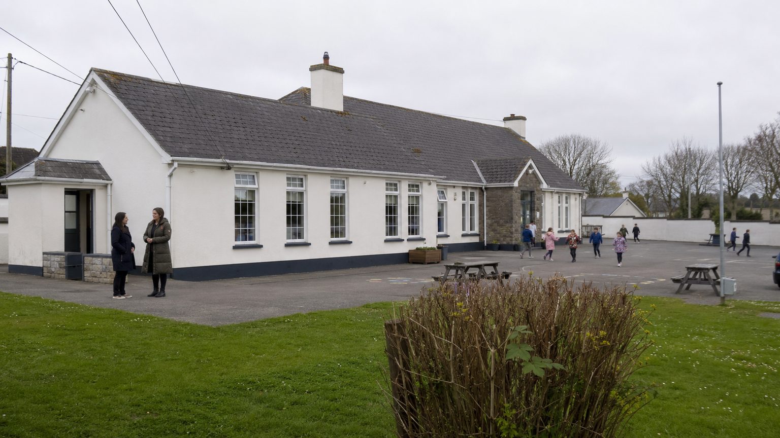 A small Irish primary school and its yard at break time